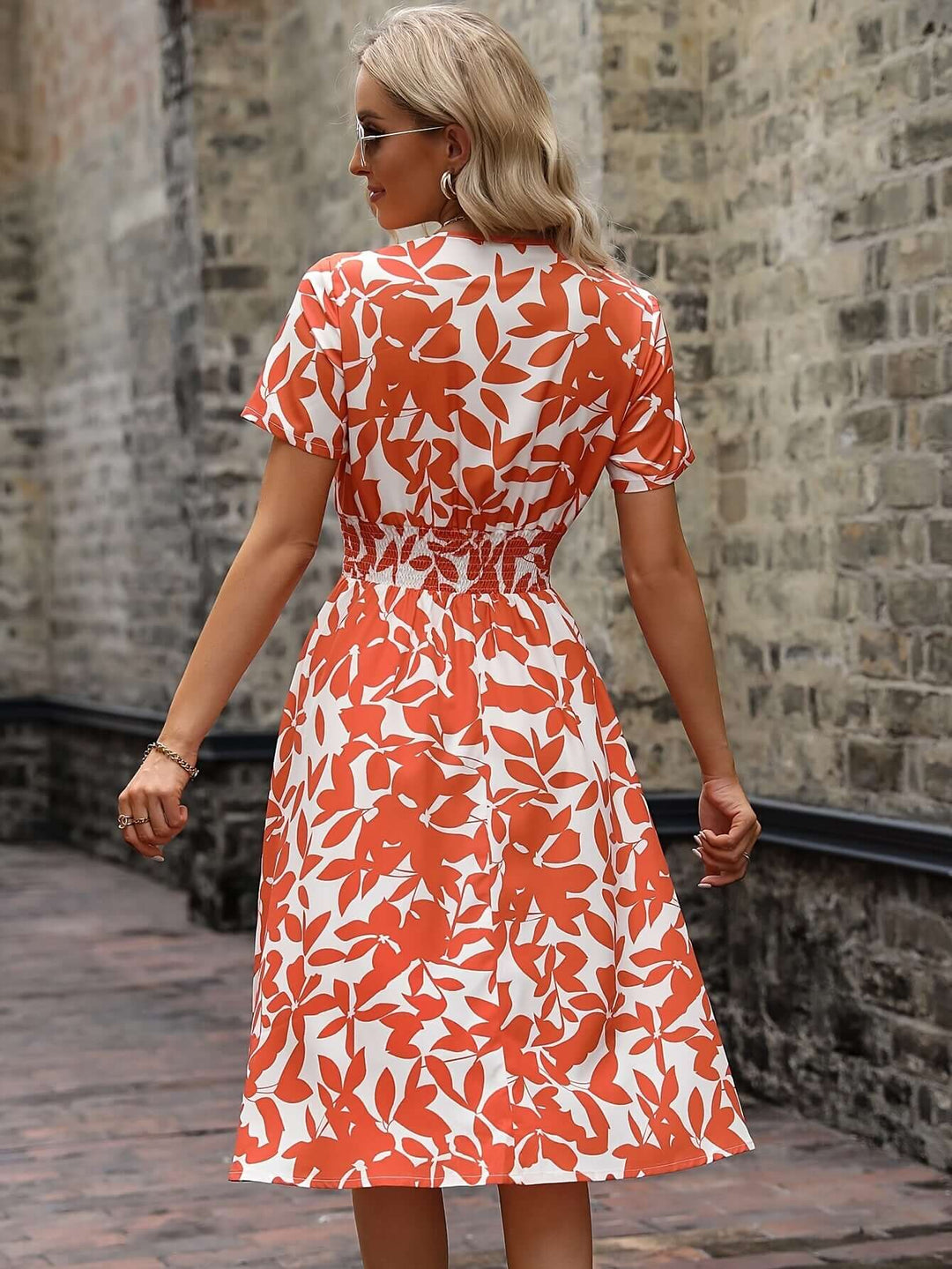 Elegant Floral Midi Dress with Smocked Detail