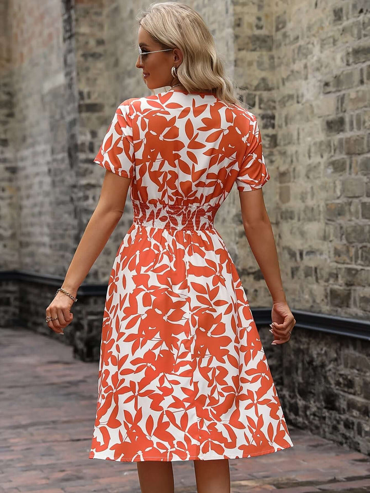Elegant Floral Midi Dress with Smocked Detail