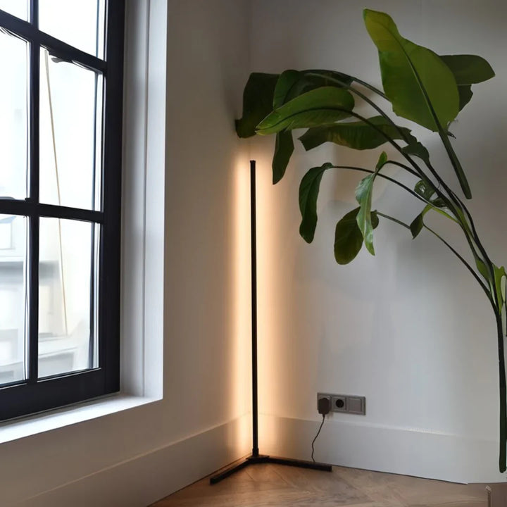 "Adjustable colorful floor lamp with smart features, showcasing dynamic hues and modern sleek design in a living room."