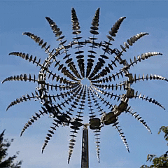 Anti-rust kinetic metal wind spinner, 18 blades, captures wind for garden decor, durable, weatherproof, vibrant spinning art.