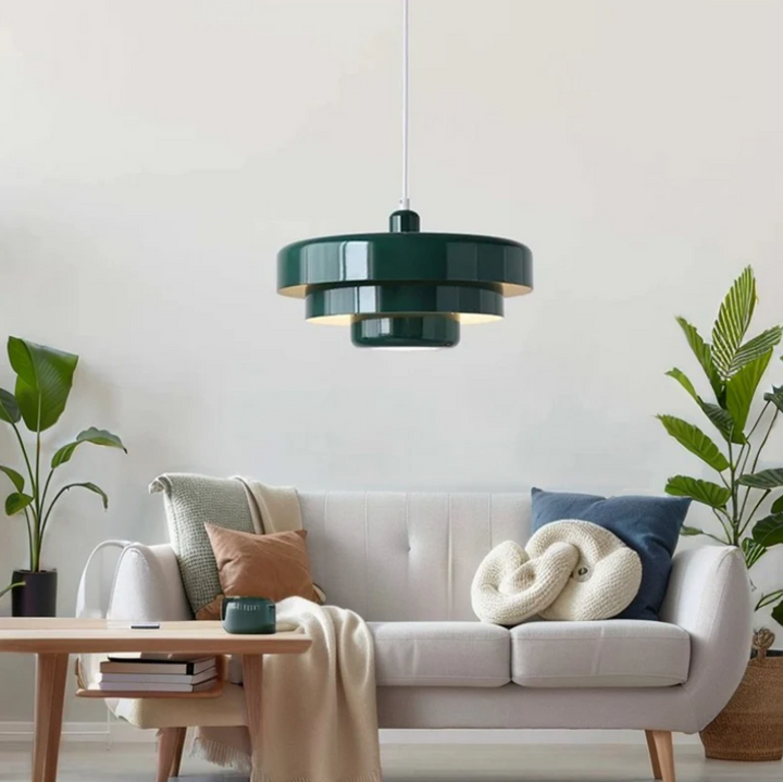 Bauhaus Metal LED Pendant Light in vibrant orange, green, and white with three-tier design illuminating a modern room.