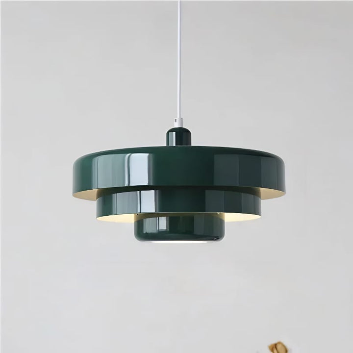 Bauhaus Metal LED Pendant Light in vibrant orange, green, and white with three-tier design illuminating a modern room.