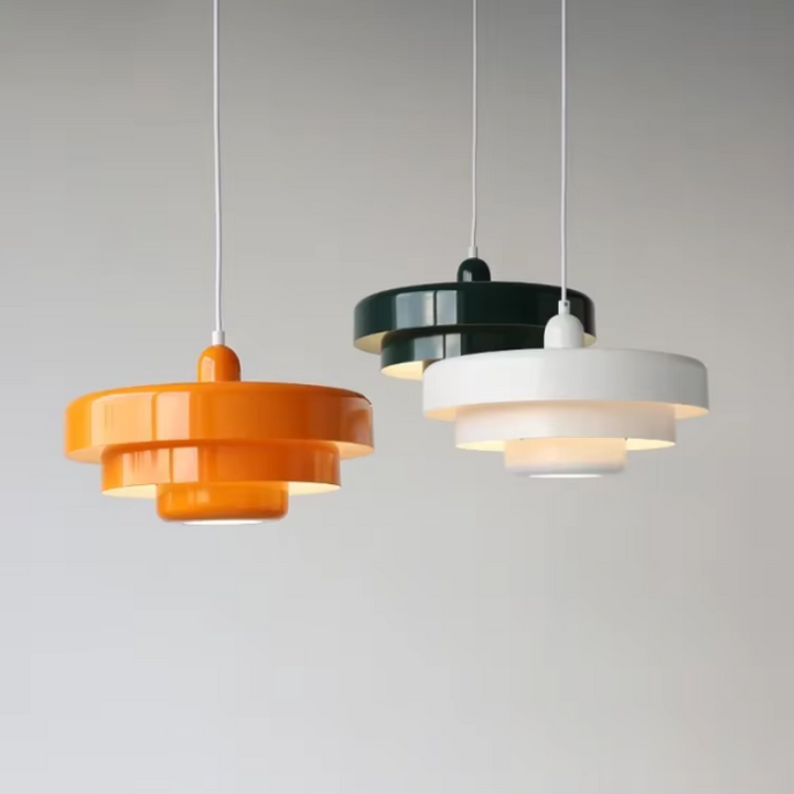 Bauhaus Metal LED Pendant Light in vibrant orange, green, and white with three-tier design illuminating a modern room.