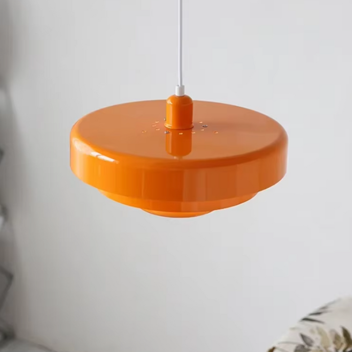 Bauhaus Metal LED Pendant Light in vibrant orange, green, and white with three-tier design illuminating a modern room.