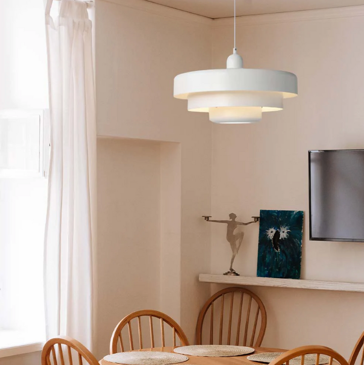 Bauhaus Metal LED Pendant Light in vibrant orange, green, and white with three-tier design illuminating a modern room.