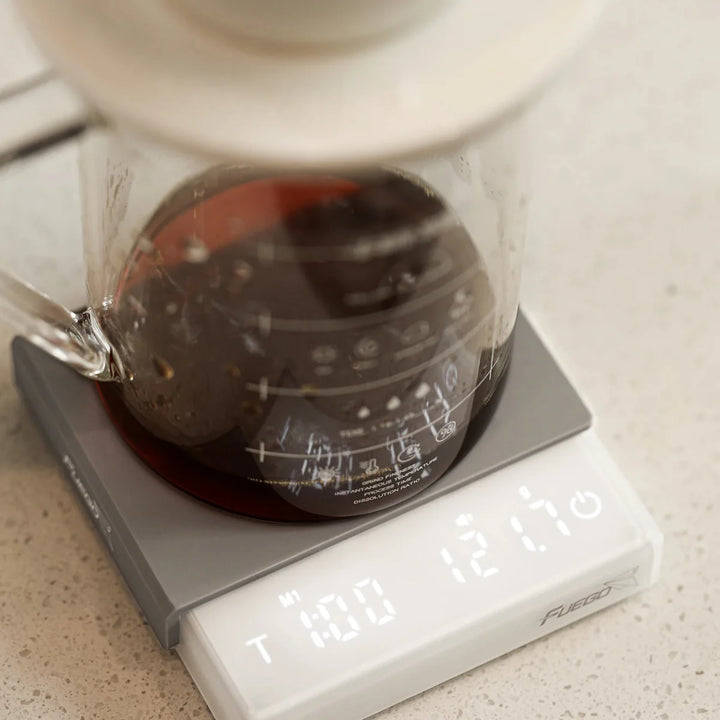 "Compact pocket digital coffee scale with timer, LCD, and high precision for kitchen and dining use, ideal for baristas."
