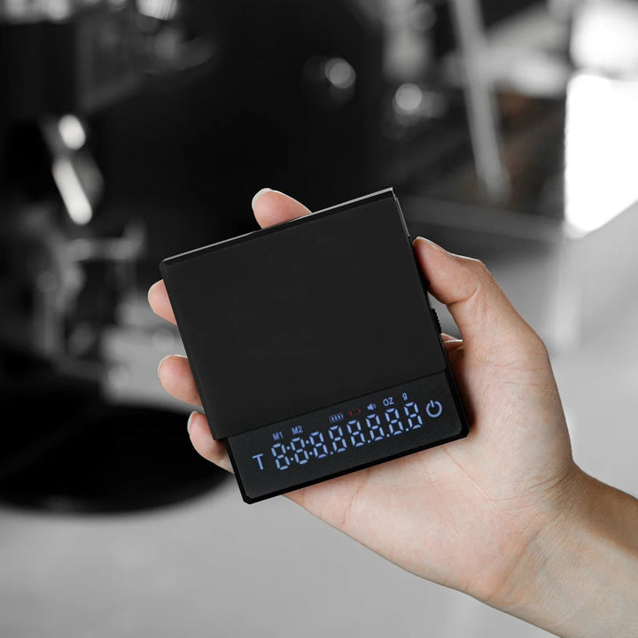 "Compact pocket digital coffee scale with timer, LCD, and high precision for kitchen and dining use, ideal for baristas."