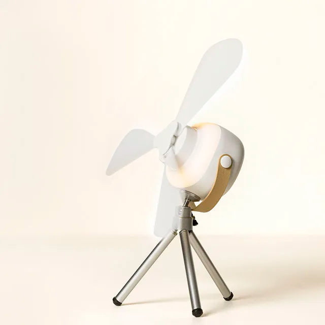 "Compact portable ceiling fan with LED light, remote, and tripod stand; blends sleek design, innovation, and convenience."