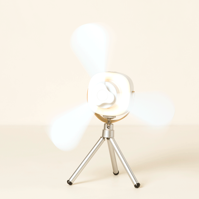 "Compact portable ceiling fan with LED light, remote, and tripod stand; blends sleek design, innovation, and convenience."