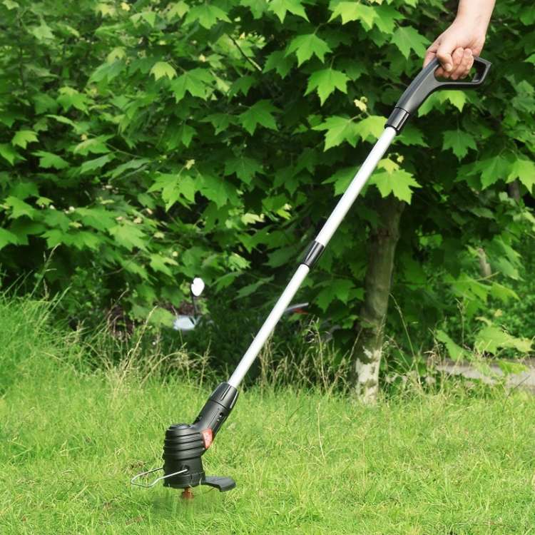 "Cordless lightweight high-power grass trimmer with ergonomic handle, cutting thick grass; ideal for easy lawn care."