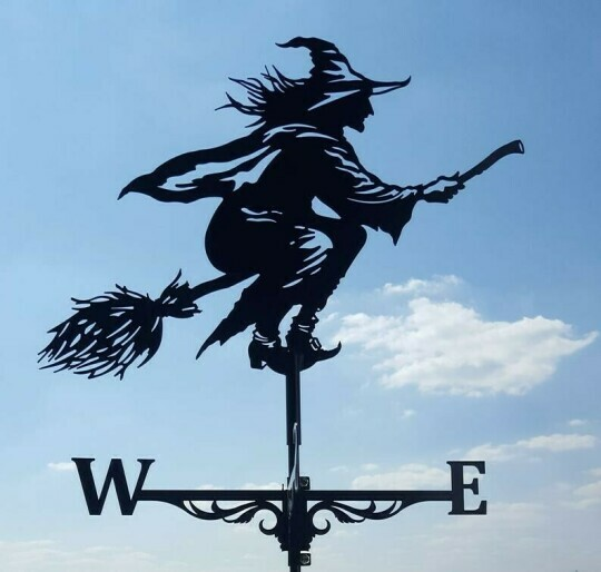 "Eccentric garden weather vane with dragon design; decorative, durable stainless steel; whimsical outdoor decor piece."