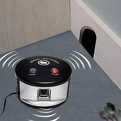 Eco-friendly solar ultrasonic squirrel repeller in a garden, featuring a slim, discreet design with solar panels for easy set