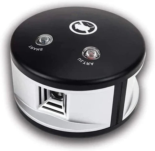 Eco-friendly solar ultrasonic squirrel repeller in a garden, featuring a slim, discreet design with solar panels for easy set