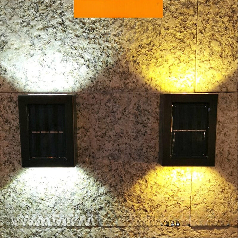 "Eco-friendly solar wall light illuminating garden fence at night; warm white LED, sleek, modern outdoor lighting."