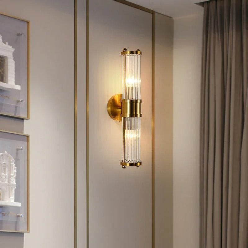 Elegant cylindrical glass wall sconce with chrome finish, crystal accents, electroplated hardware. Ideal for modern interiors