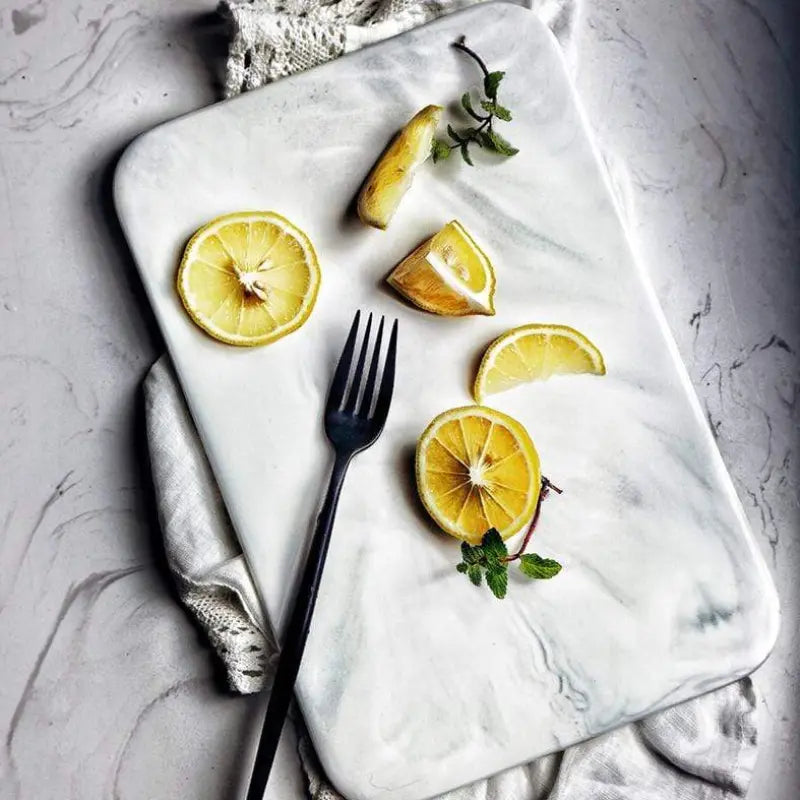 Elegant marble cutting board with smooth, luxurious surface for gourmet cooking, perfect for slicing and artistic serving.