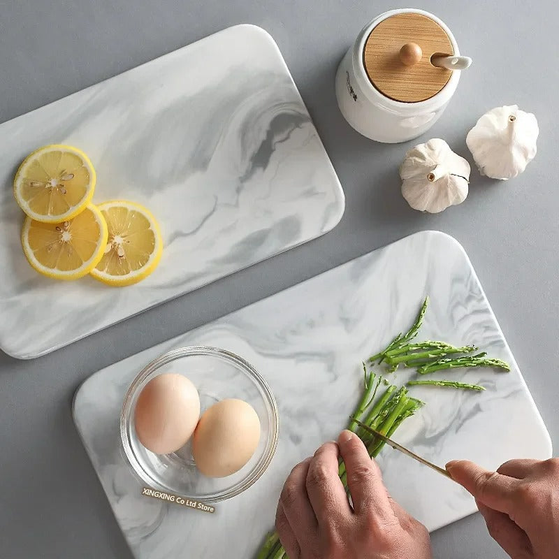 Elegant marble cutting board with smooth, luxurious surface for gourmet cooking, perfect for slicing and artistic serving.