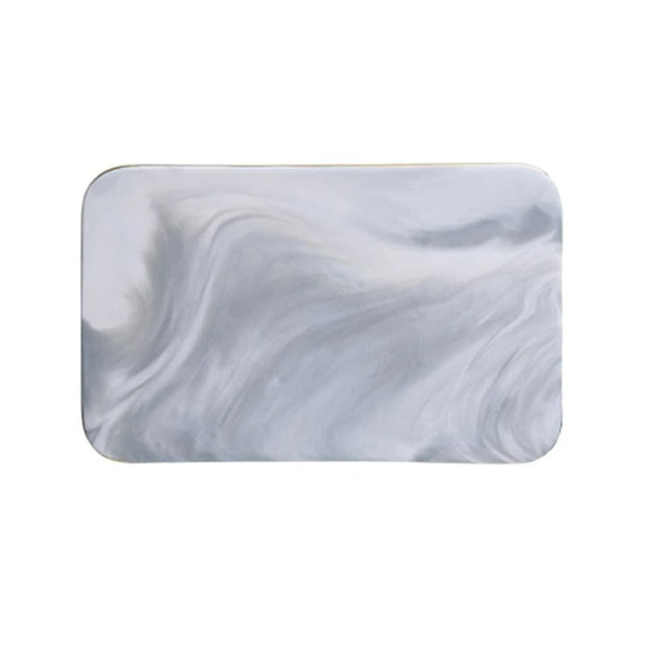 Elegant marble cutting board with smooth, luxurious surface for gourmet cooking, perfect for slicing and artistic serving.