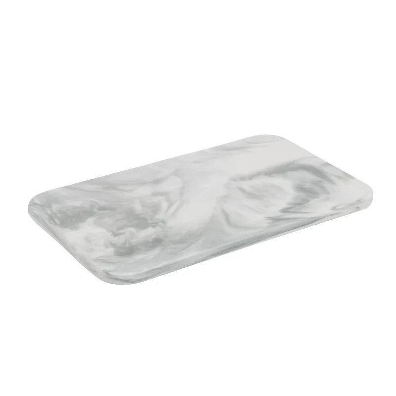 Elegant marble cutting board with smooth, luxurious surface for gourmet cooking, perfect for slicing and artistic serving.