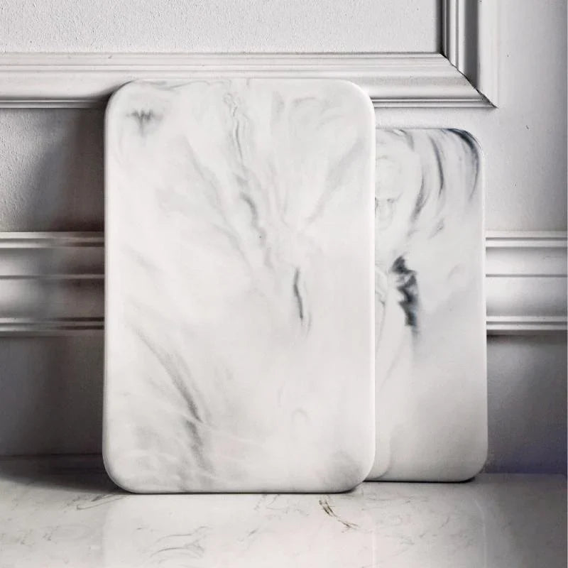 Elegant marble cutting board with smooth, luxurious surface for gourmet cooking, perfect for slicing and artistic serving.