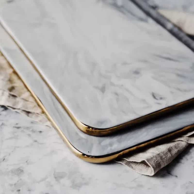 Elegant marble cutting board with smooth, luxurious surface for gourmet cooking, perfect for slicing and artistic serving.