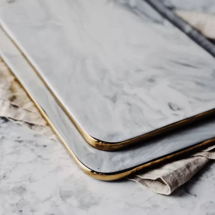 Elegant marble cutting board with smooth, luxurious surface for gourmet cooking, perfect for slicing and artistic serving.