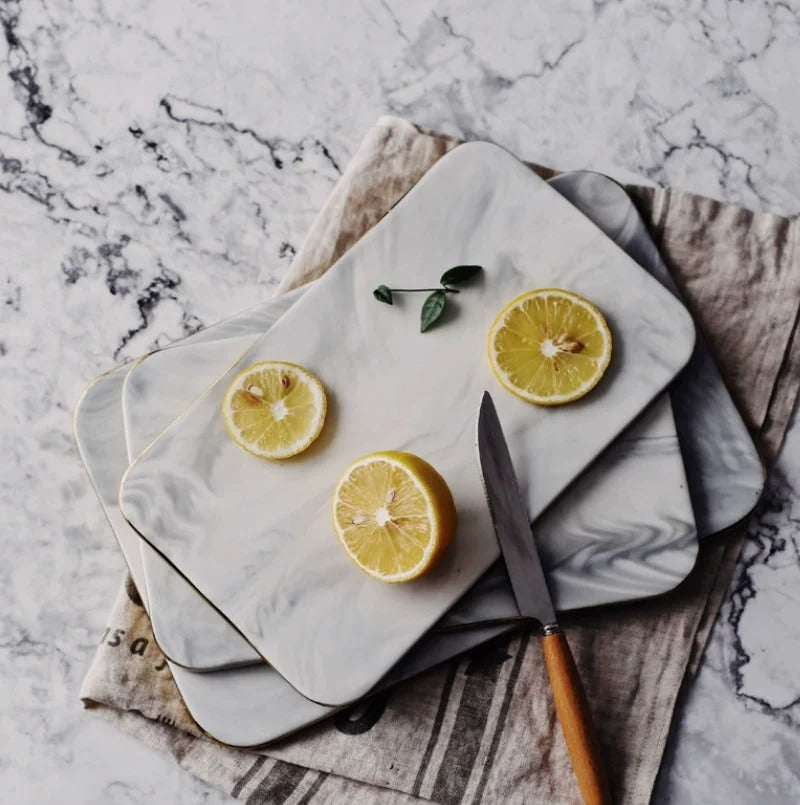 Elegant marble cutting board with smooth, luxurious surface for gourmet cooking, perfect for slicing and artistic serving.