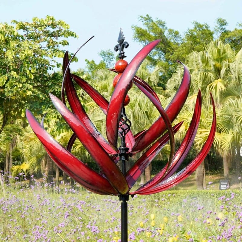 Elegant metal wind spinner for garden, showing smooth rotation and vibrant red and blue colors, enhancing outdoor decor.