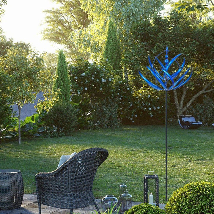 Elegant metal wind spinner for garden, showing smooth rotation and vibrant red and blue colors, enhancing outdoor decor.