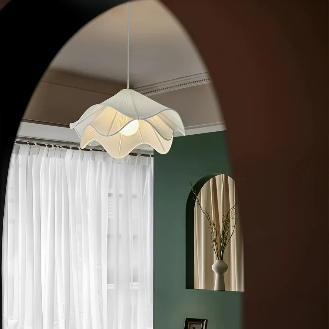Elegant white fabric flower pendant light with soft LED glow, resembling delicate petals, perfect for modern interiors.