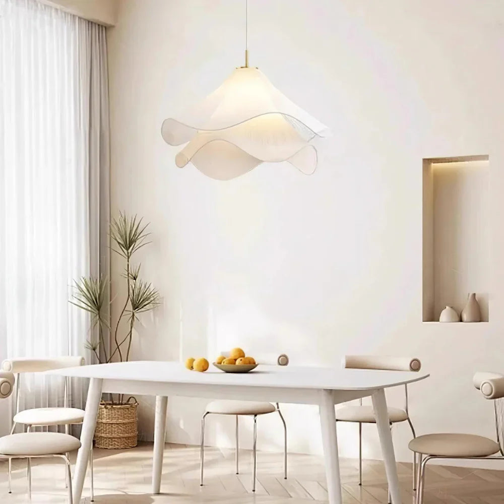 Elegant white fabric flower pendant light with soft LED glow, resembling delicate petals, perfect for modern interiors.