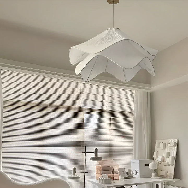 Elegant white fabric flower pendant light with soft LED glow, resembling delicate petals, perfect for modern interiors.