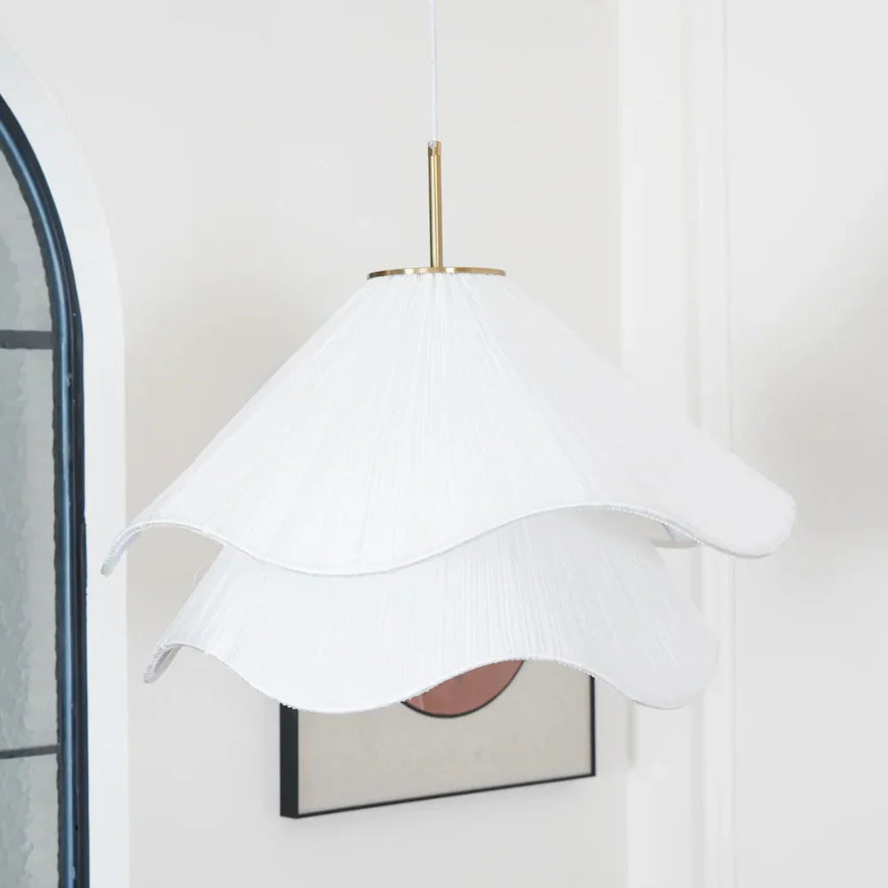 Elegant white fabric flower pendant light with soft LED glow, resembling delicate petals, perfect for modern interiors.