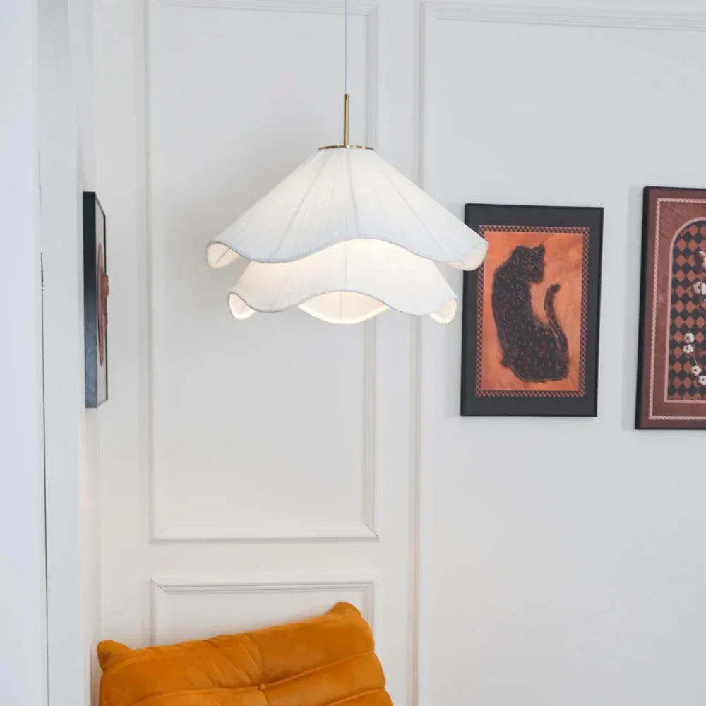 Elegant white fabric flower pendant light with soft LED glow, resembling delicate petals, perfect for modern interiors.