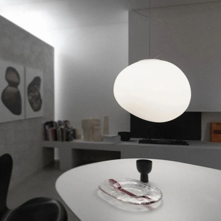Elegant white glass globe pendant ceiling light with sleek design, ideal for modern decor, enhances dining rooms and lounges.
