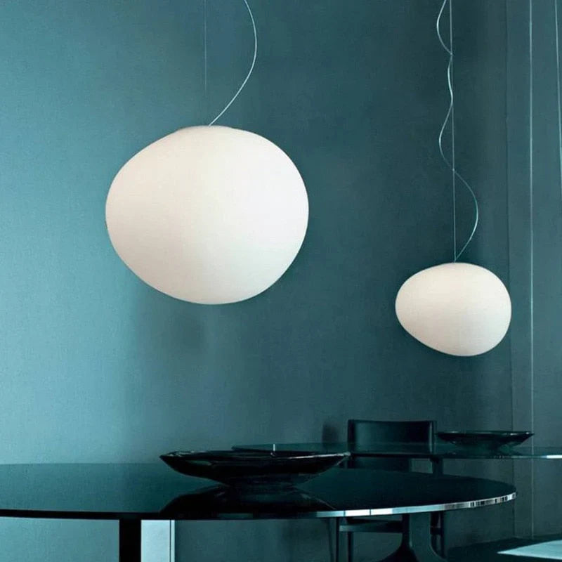 Elegant white glass globe pendant ceiling light with sleek design, ideal for modern decor, enhances dining rooms and lounges.