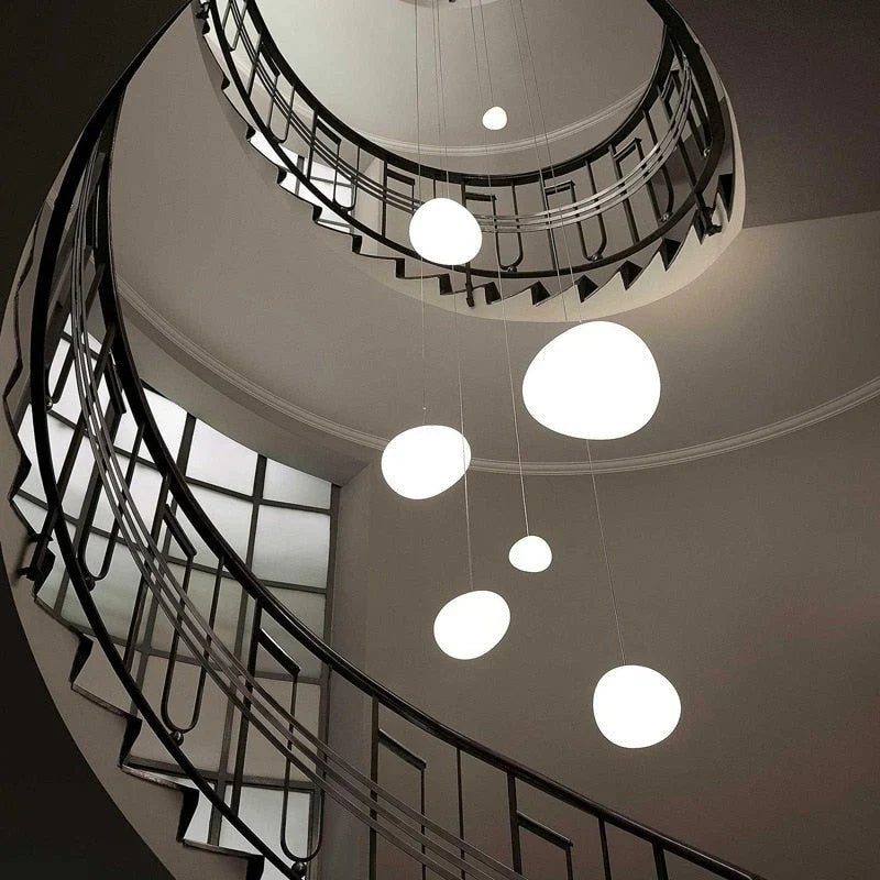 Elegant white glass globe pendant ceiling light with sleek design, ideal for modern decor, enhances dining rooms and lounges.