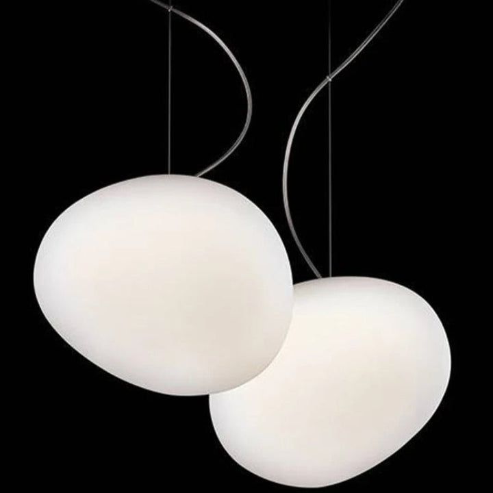 Elegant white glass globe pendant ceiling light with sleek design, ideal for modern decor, enhances dining rooms and lounges.