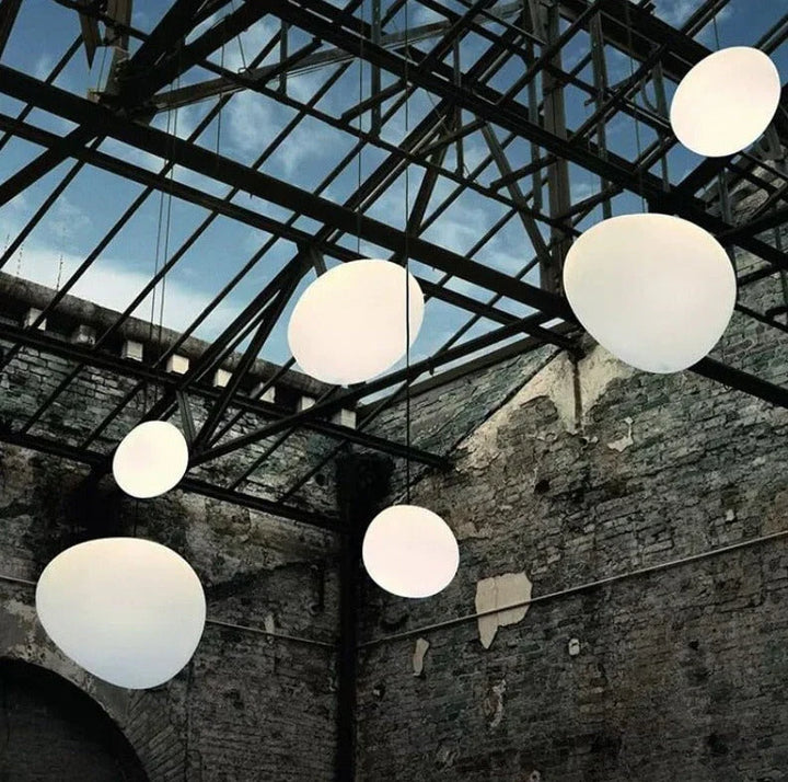 Elegant white glass globe pendant ceiling light with sleek design, ideal for modern decor, enhances dining rooms and lounges.