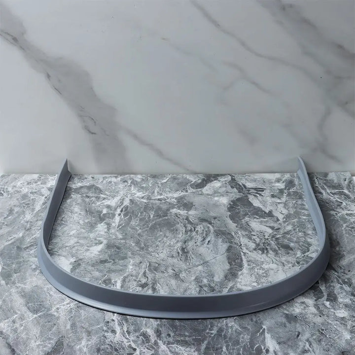Flexible silicone shower barrier for leakproof seal, keeping bathroom dry. Bendable, self-adhesive strip for easy installatio