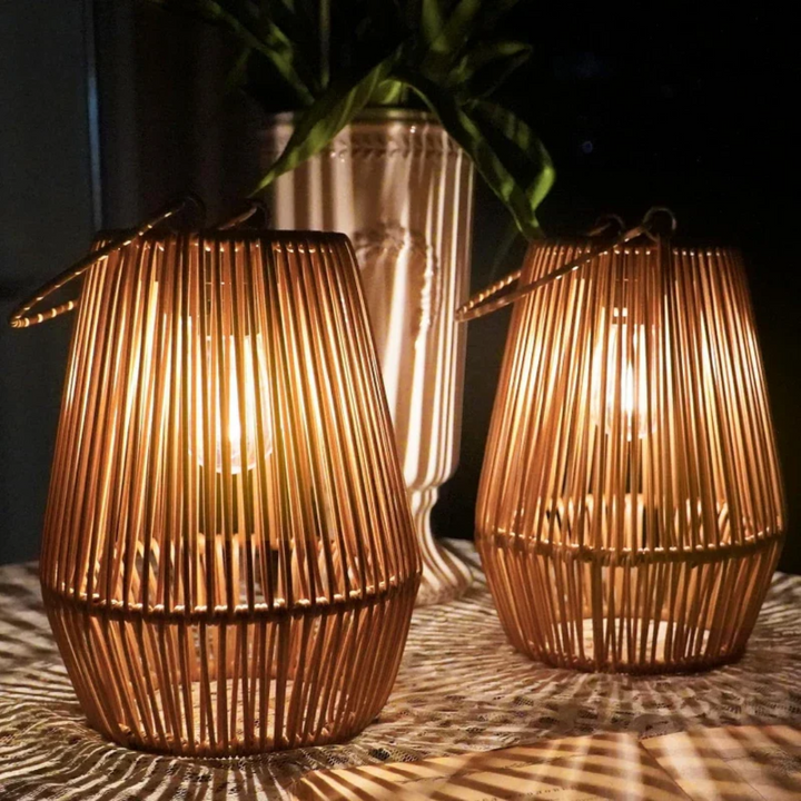 Handwoven solar lantern for gardens, featuring a brown rattan design, LED light, and eco-friendly solar-powered technology.