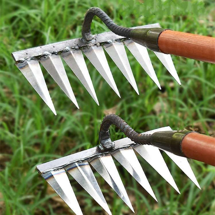 Heavy-duty stainless steel garden rake with deep-penetrating tines, ergonomic handle, and durable, rust-resistant design.