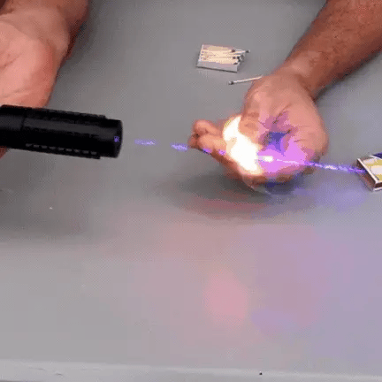 "High-power blue tactical laser torch for outdoor use, features durable aluminum body and adjustable focus."