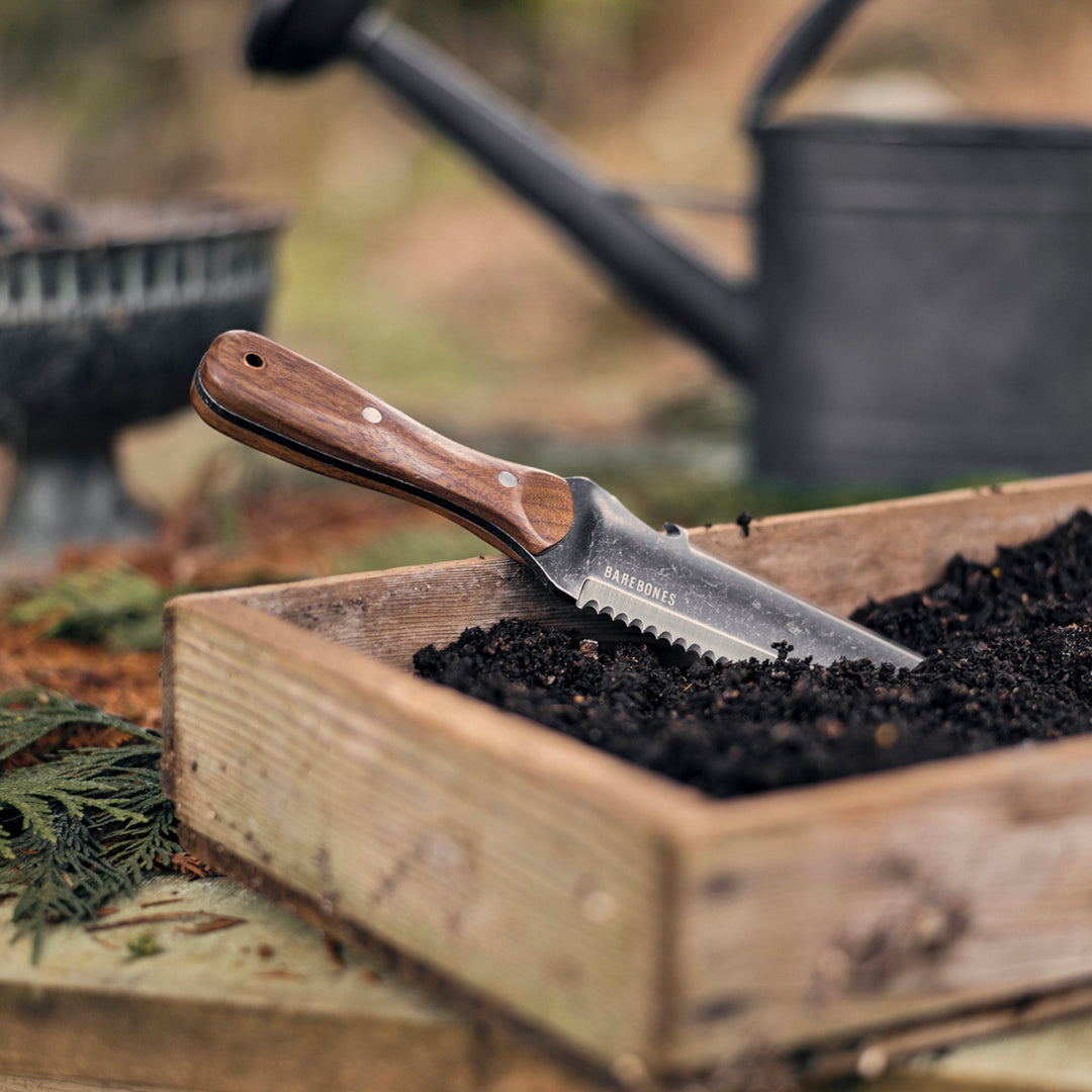 "Hori Hori Classic Gardening Tool with serrated stainless steel blade and ergonomic walnut handle for digging and weeding."