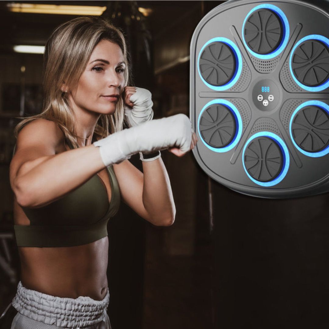 "Interactive music boxing machine for adults & kids, with adjustable settings, shown in use with vibrant background and icons
