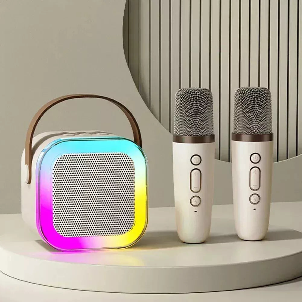 "Kids portable mini karaoke machine with wireless mics, LED lights, vibrant colors, fun for ages 3-12."