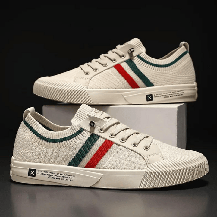 "Men's casual knit sneakers, breathable and lightweight with a lace-up design, shown in a stylish side view."