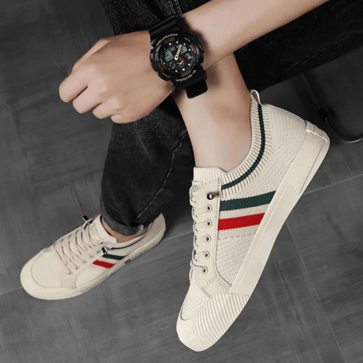 "Men's casual knit sneakers, breathable and lightweight with a lace-up design, shown in a stylish side view."