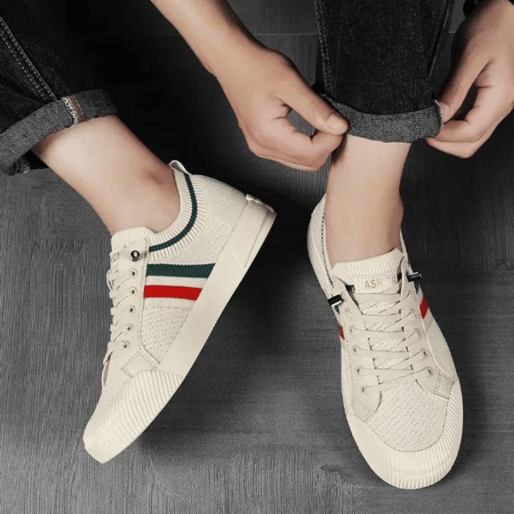 "Men's casual knit sneakers, breathable and lightweight with a lace-up design, shown in a stylish side view."