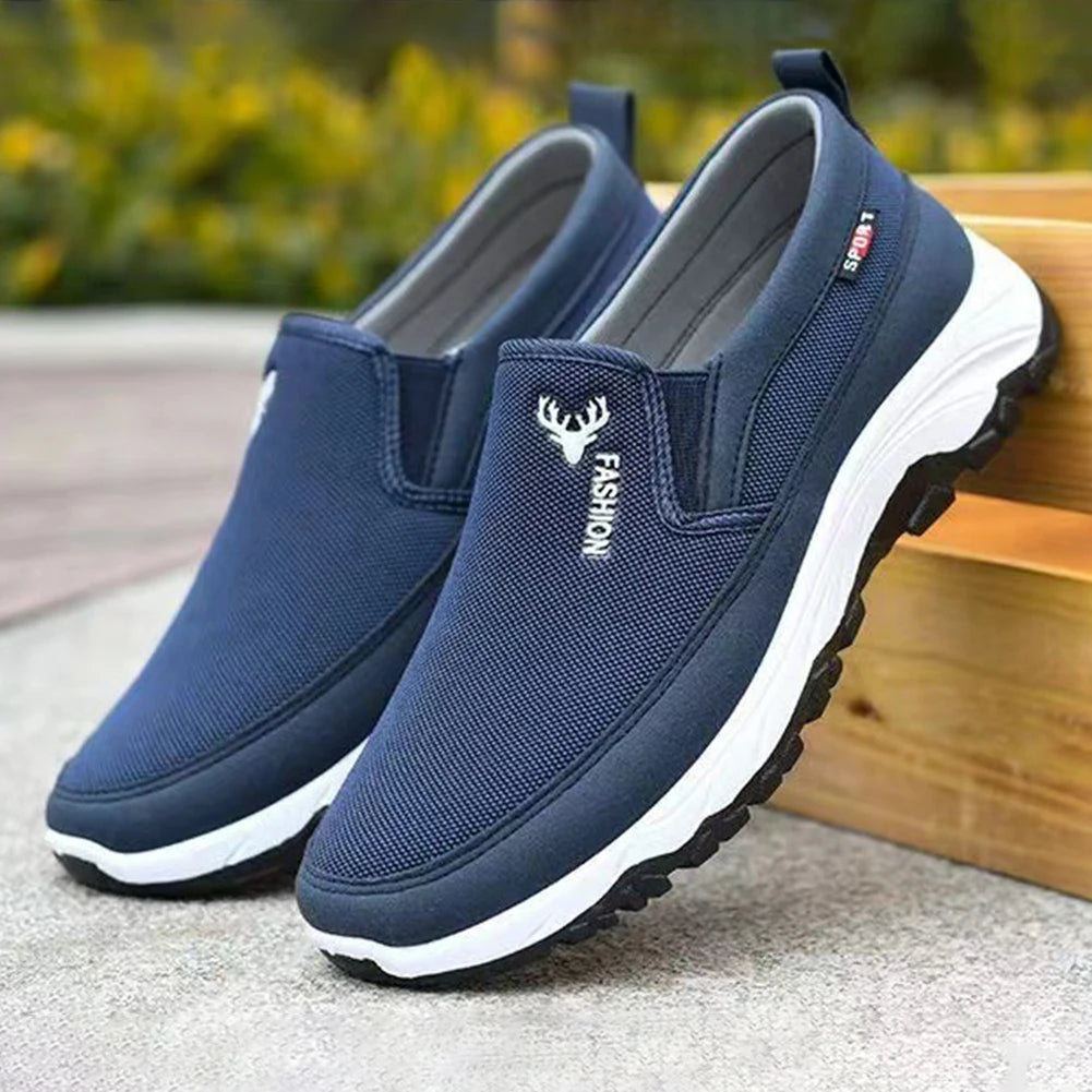 Men's cushioned slip-on walking shoes with breathable mesh, elastic panels, and grip outsole for comfort and stability.